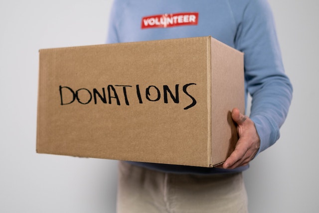 Man holding donation box